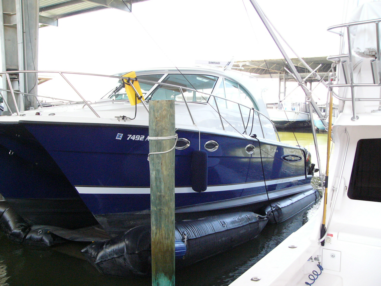 Blue v-hull boat on Air-Dock boat lift